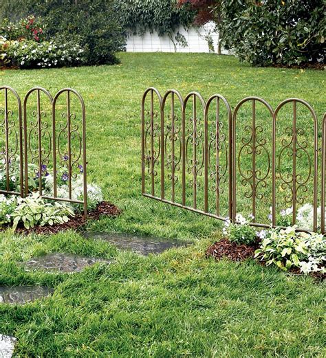 pallet and green metal fence stake enclosure|garden fence panels.